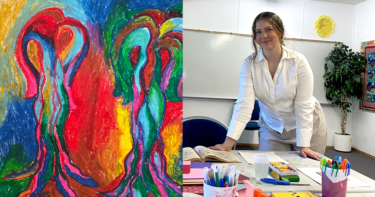 A woman standing by a table with art supplies